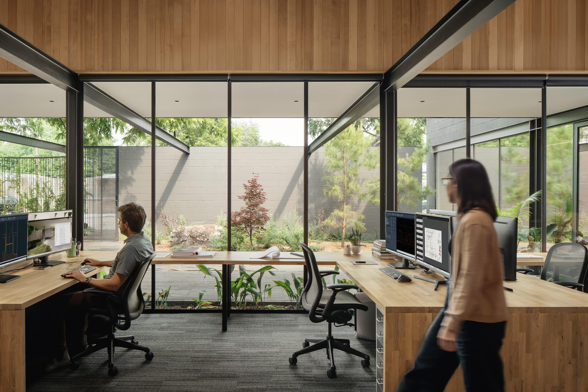 ECC Creative - Desks facing courtyard; A Parallel Architecture